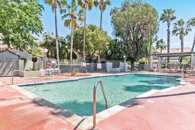 view of swimming pool featuring a patio area