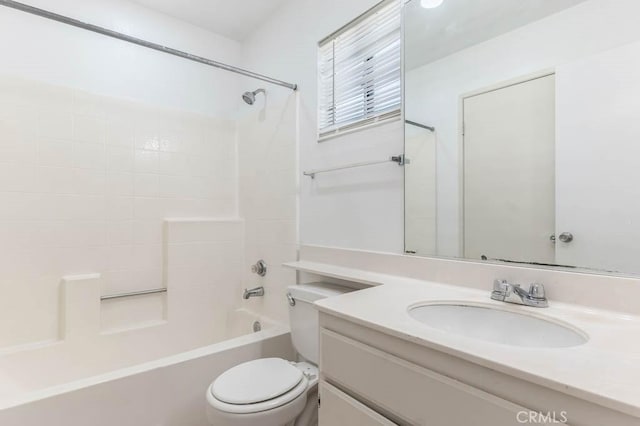 full bathroom featuring toilet, vanity, and washtub / shower combination