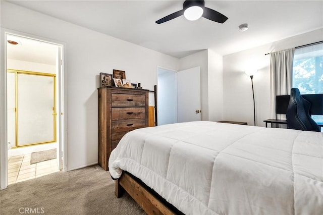 carpeted bedroom featuring ceiling fan