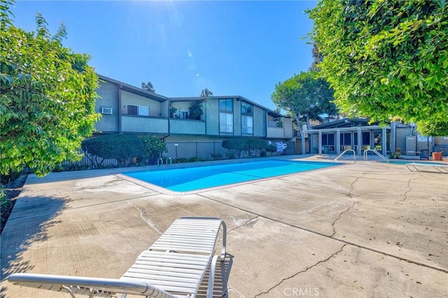 view of pool featuring a patio area