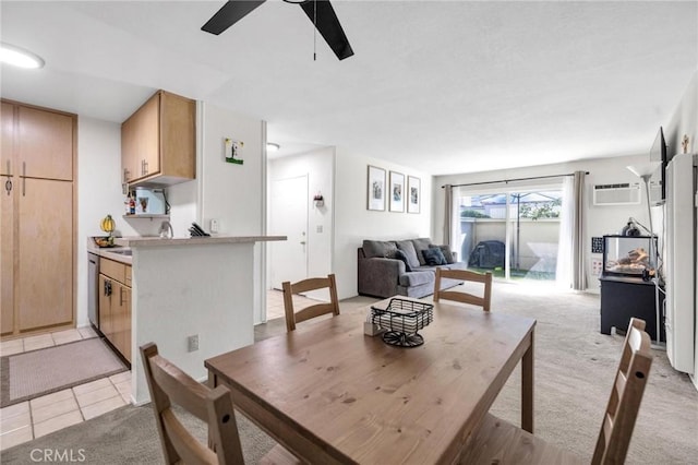 dining space featuring an AC wall unit, light carpet, and ceiling fan