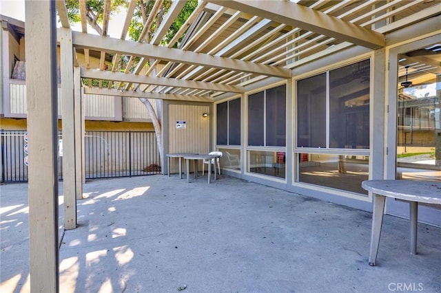 view of patio with a sunroom and a pergola