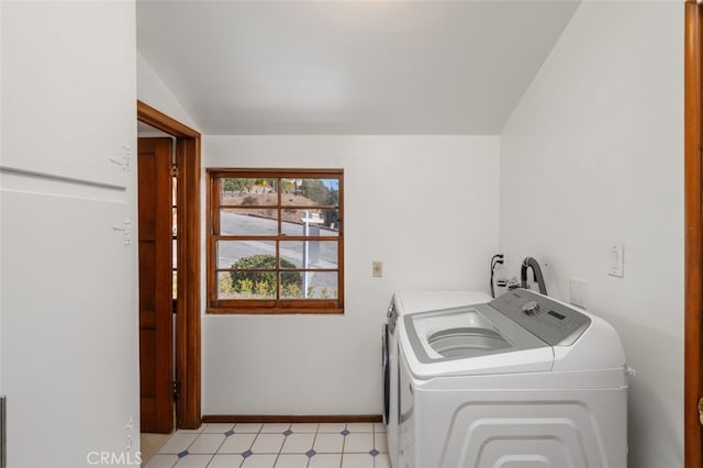 clothes washing area with washer and clothes dryer