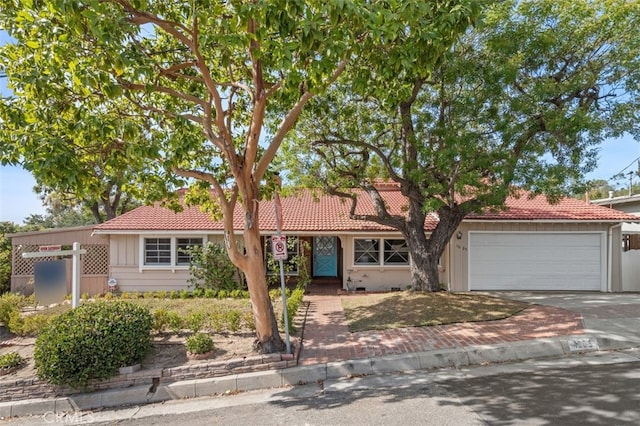 single story home with a garage