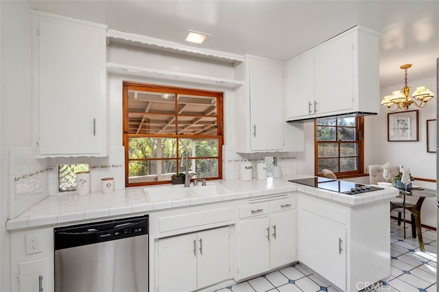 kitchen featuring tile countertops, dishwasher, backsplash, white cabinets, and sink