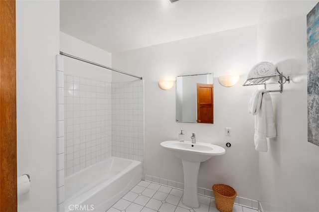 bathroom featuring tile patterned flooring and tiled shower / bath combo