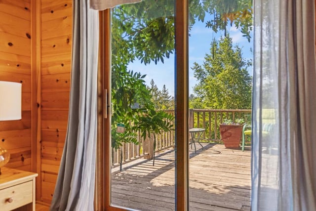 entryway featuring wooden walls