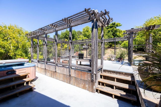 dock area with a hot tub