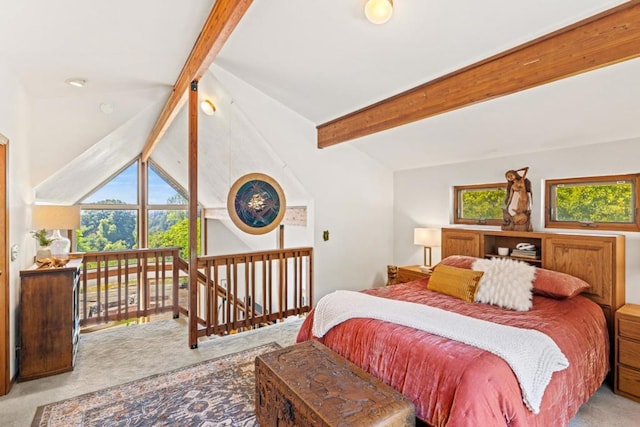 carpeted bedroom featuring multiple windows and lofted ceiling with beams