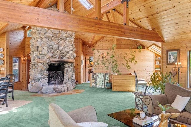 living room with a stone fireplace, carpet, and wood walls