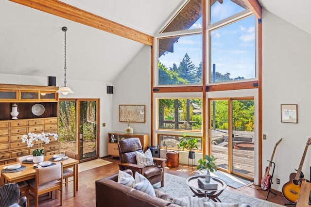 living room featuring beam ceiling and high vaulted ceiling