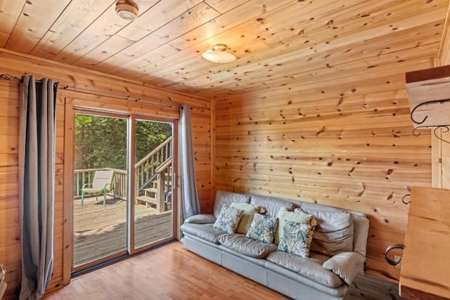 interior space featuring wood ceiling, wooden walls, and wood-type flooring