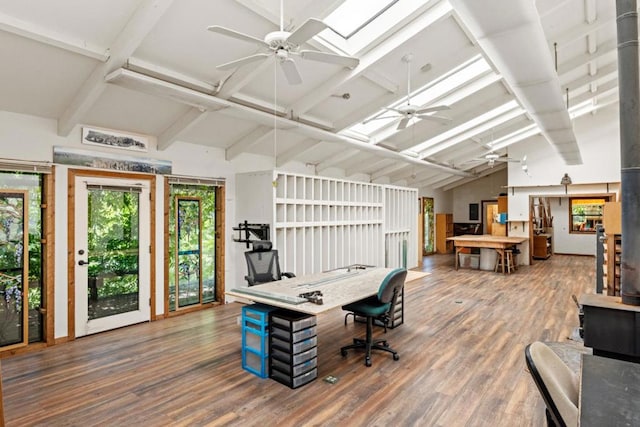 office space with hardwood / wood-style floors, lofted ceiling with skylight, and ceiling fan