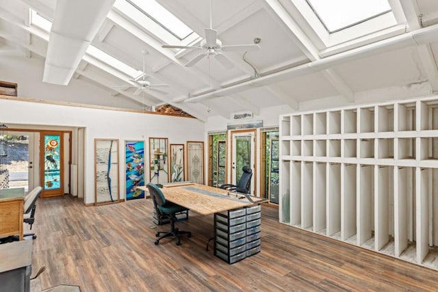 office space with hardwood / wood-style flooring, ceiling fan, and vaulted ceiling with skylight