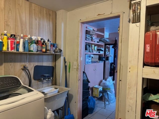 washroom featuring washer / dryer and light tile patterned floors