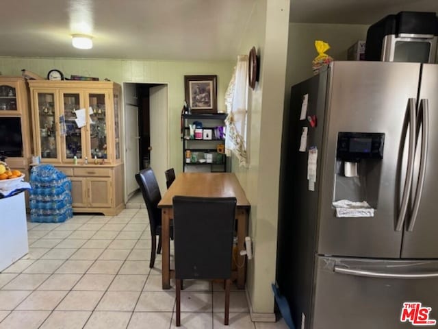 dining area featuring light tile patterned floors