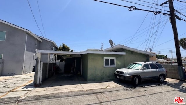 view of front of home with a carport