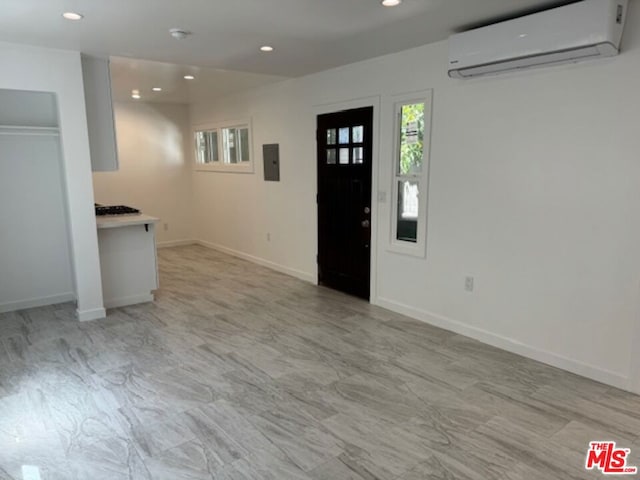 foyer with a wall mounted AC