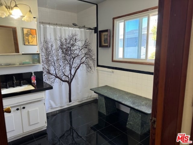 bathroom with tile patterned flooring and vanity