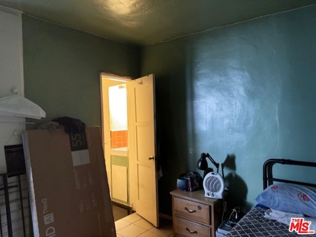 bedroom featuring light tile patterned floors