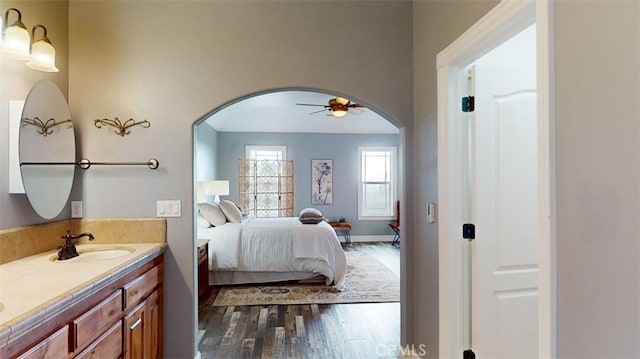 bathroom with vanity, wood-type flooring, and ceiling fan