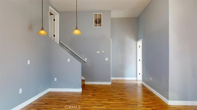 stairs with hardwood / wood-style floors