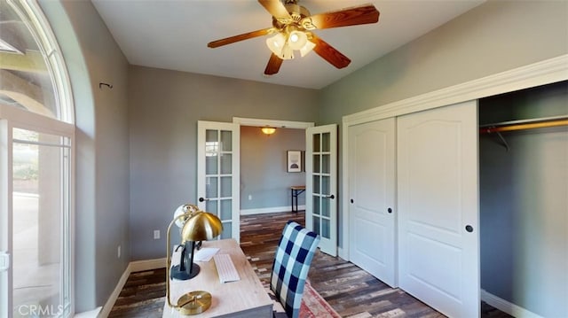 home office featuring french doors, dark wood-type flooring, and ceiling fan