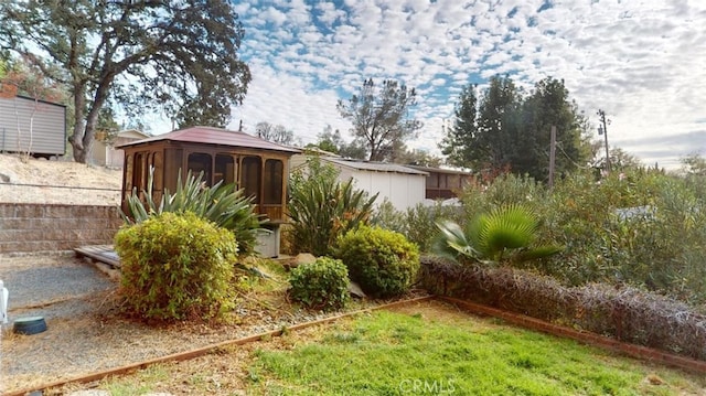 view of yard featuring a sunroom