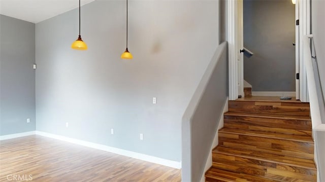 staircase featuring hardwood / wood-style floors