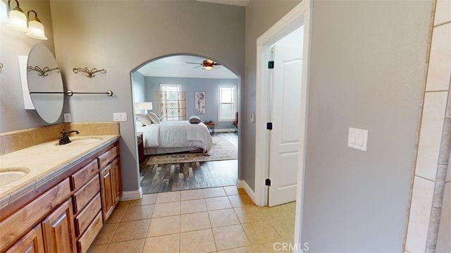 bathroom featuring vanity, wood-type flooring, and ceiling fan