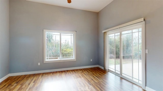 empty room featuring hardwood / wood-style flooring and ceiling fan