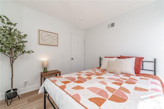 bedroom featuring hardwood / wood-style floors