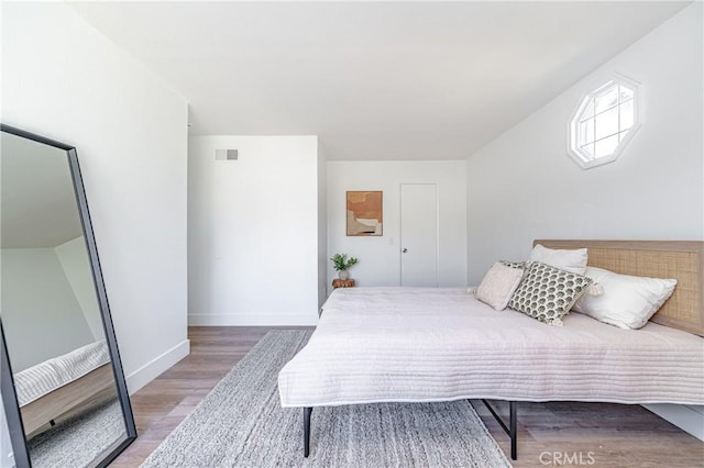 bedroom with wood-type flooring