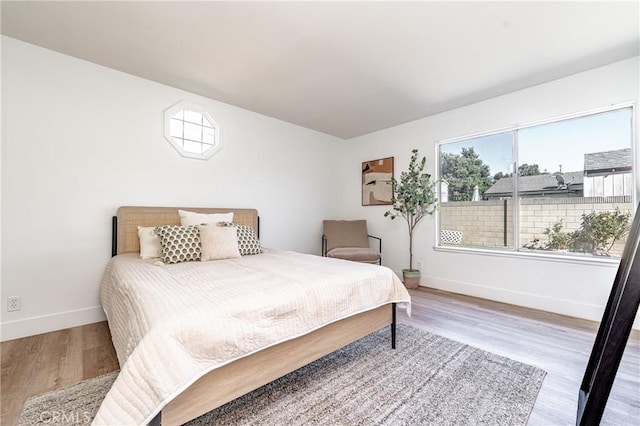 bedroom featuring wood-type flooring