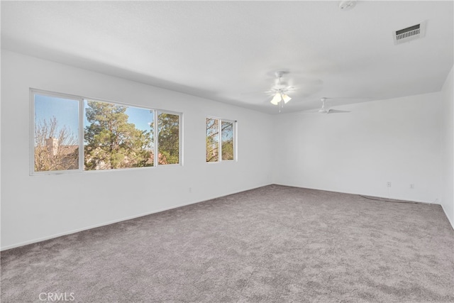 carpeted empty room with ceiling fan