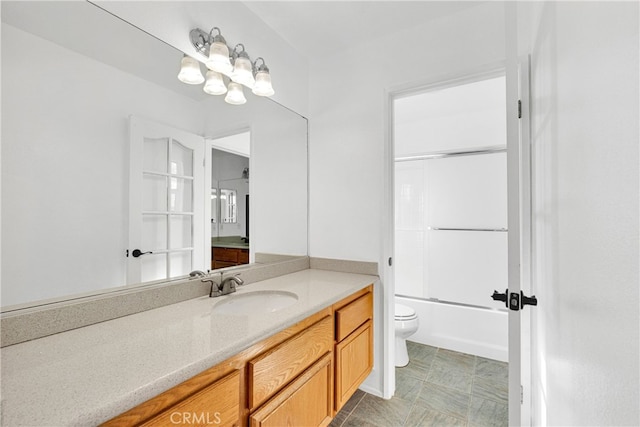 full bathroom with bathtub / shower combination, vanity, and toilet