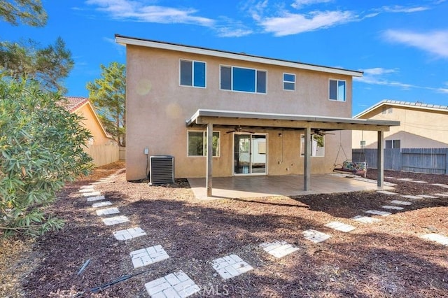 back of property featuring ceiling fan, a patio area, and central AC