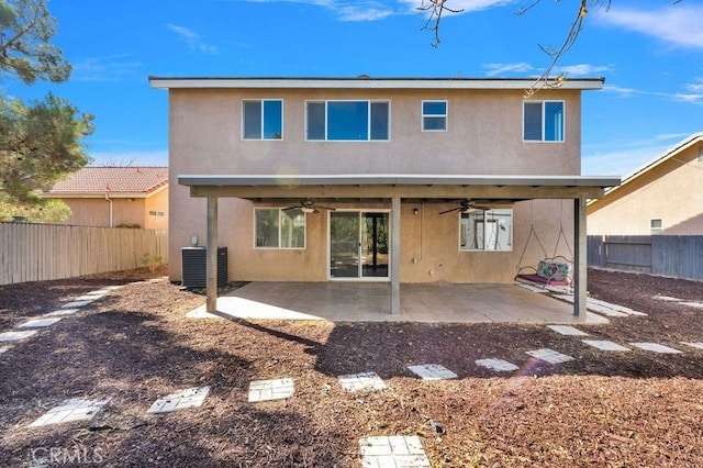 rear view of house featuring central air condition unit, a patio area, and ceiling fan