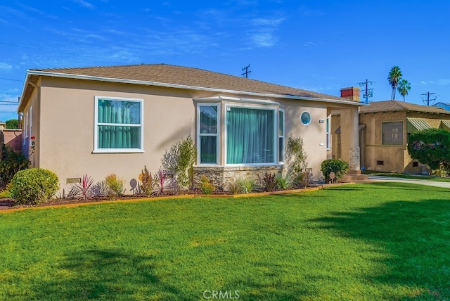 view of front of property with a front lawn