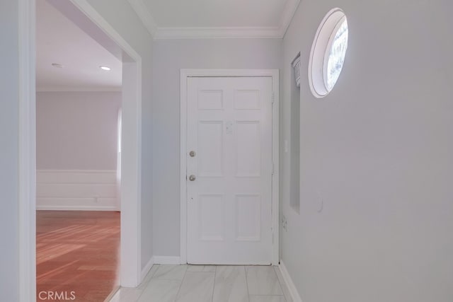 interior space with light wood-type flooring and ornamental molding