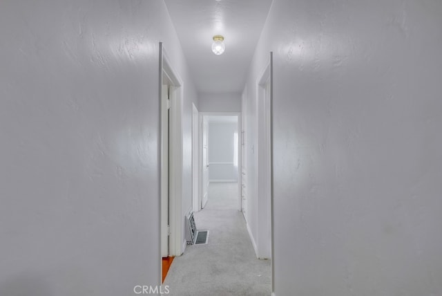 corridor with light carpet