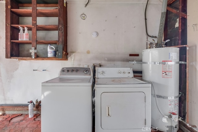 laundry room with secured water heater and washing machine and dryer