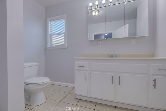 bathroom featuring tile patterned floors, vanity, and toilet