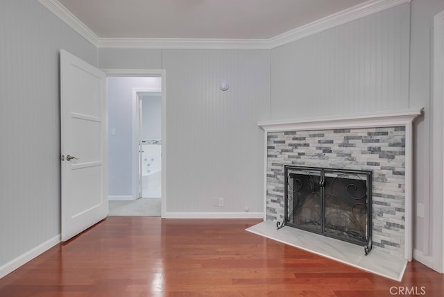 unfurnished living room with hardwood / wood-style floors and ornamental molding