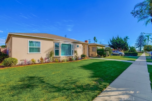 ranch-style house featuring a front yard