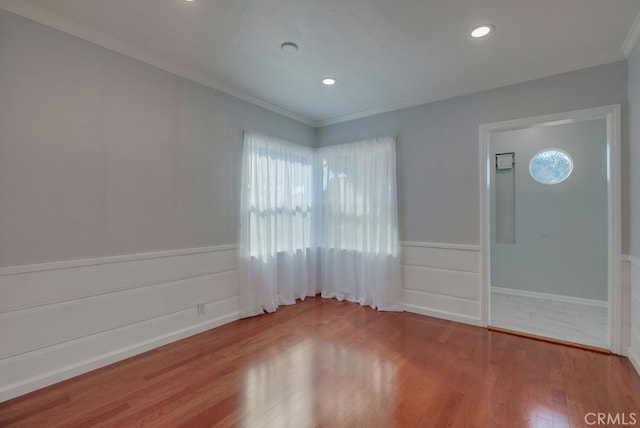 interior space featuring hardwood / wood-style floors and ornamental molding