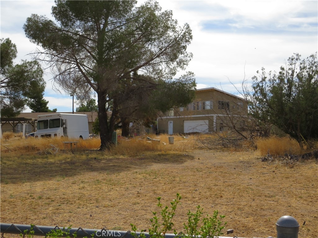 view of yard with a garage