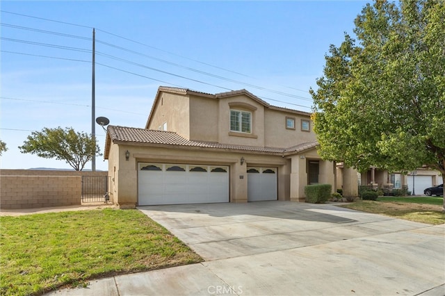 mediterranean / spanish house with a front yard and a garage