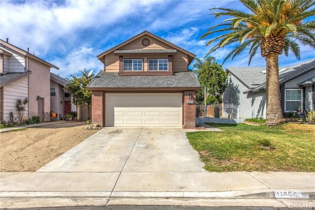 view of front property with a garage and a front lawn