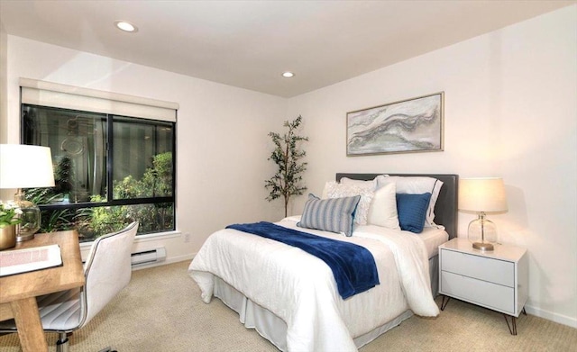 bedroom featuring light colored carpet and baseboard heating